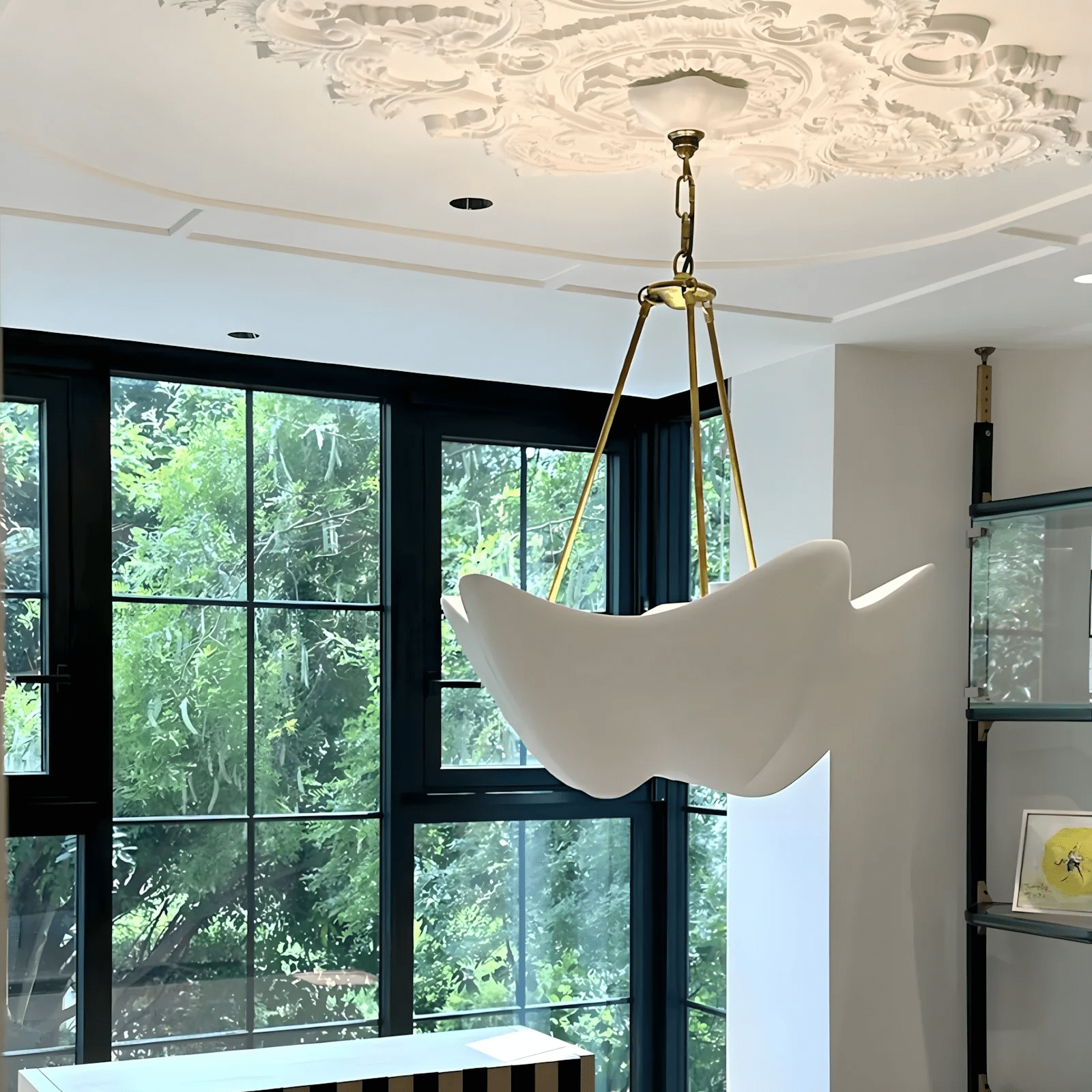 Side view of metal chandelier for scale and shape reference