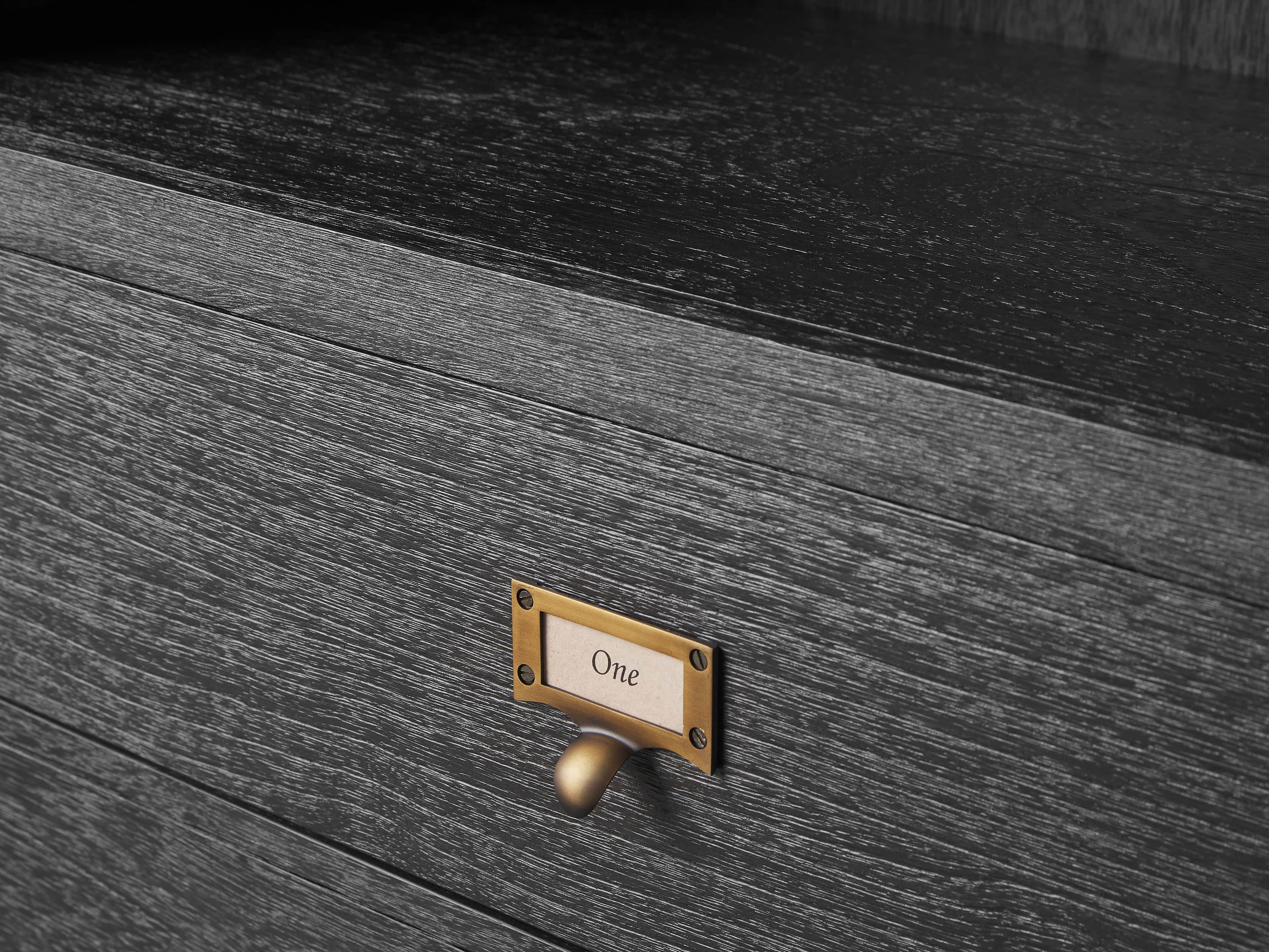 Side view of brass lighting fixture for scale and shape reference