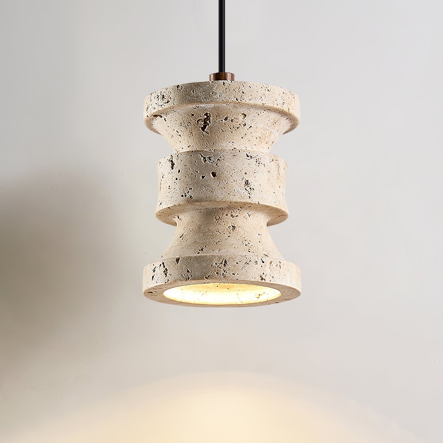 Close-up angle of Ardelle Travertine Pendant Lamp showing form and material detail