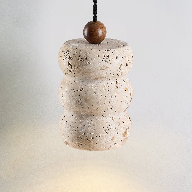 Close-up angle of Dune Pebble Travertine Pendant Light showing form and material detail