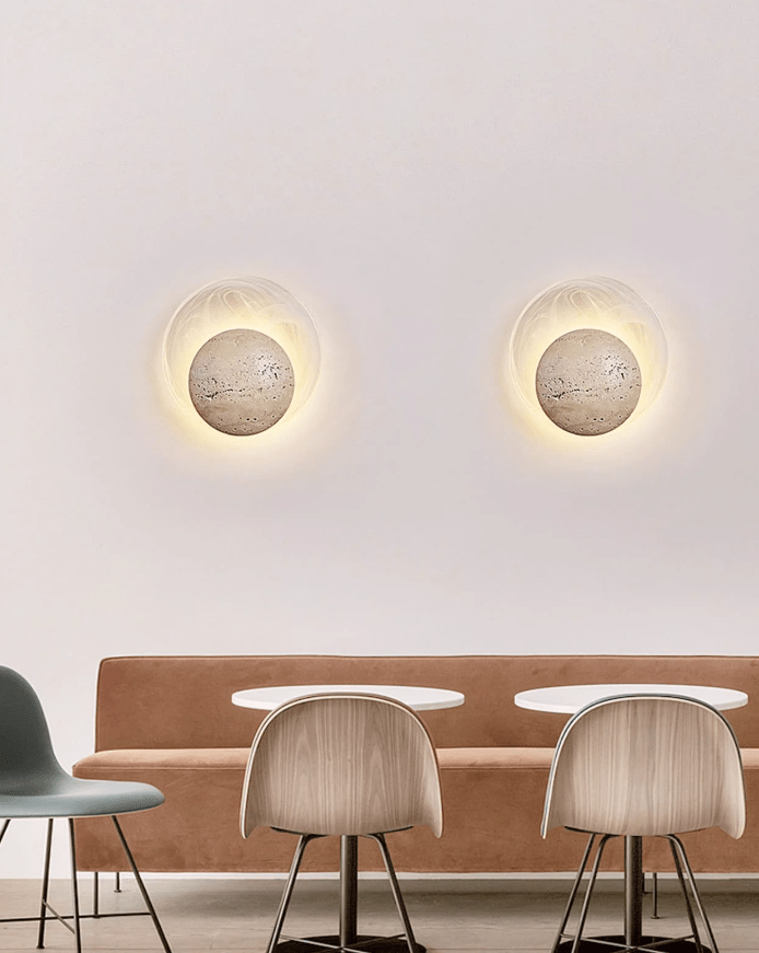 Close-up angle of Genesis Travertine Wall Lamp showing form and material detail