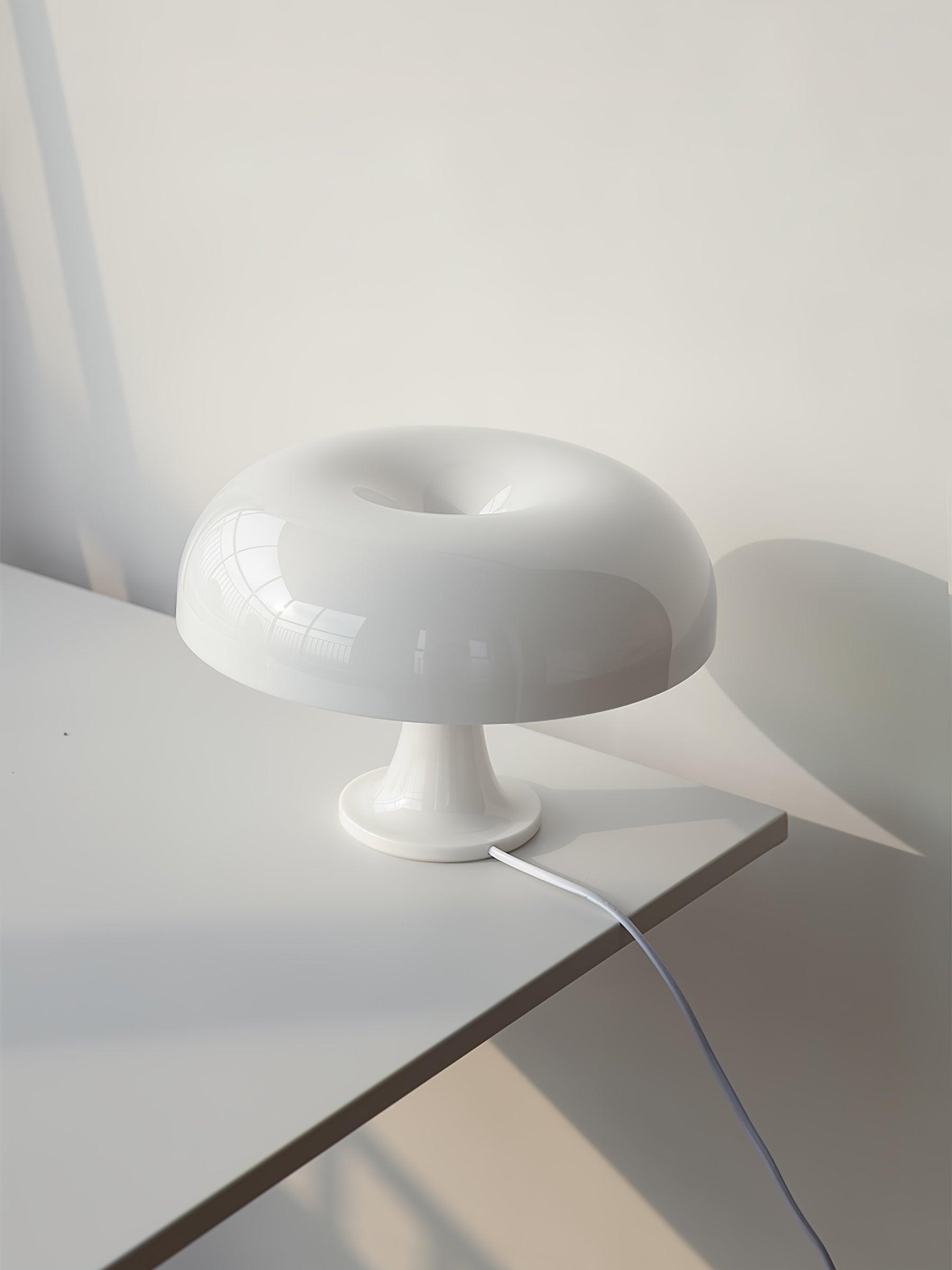 Side view of metal table lamp for scale and shape reference
