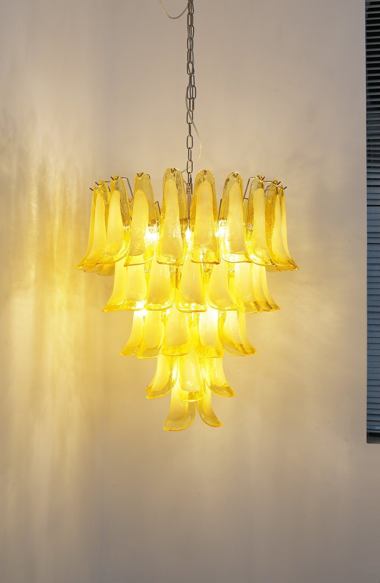 Side view of glass chandelier for scale and shape reference