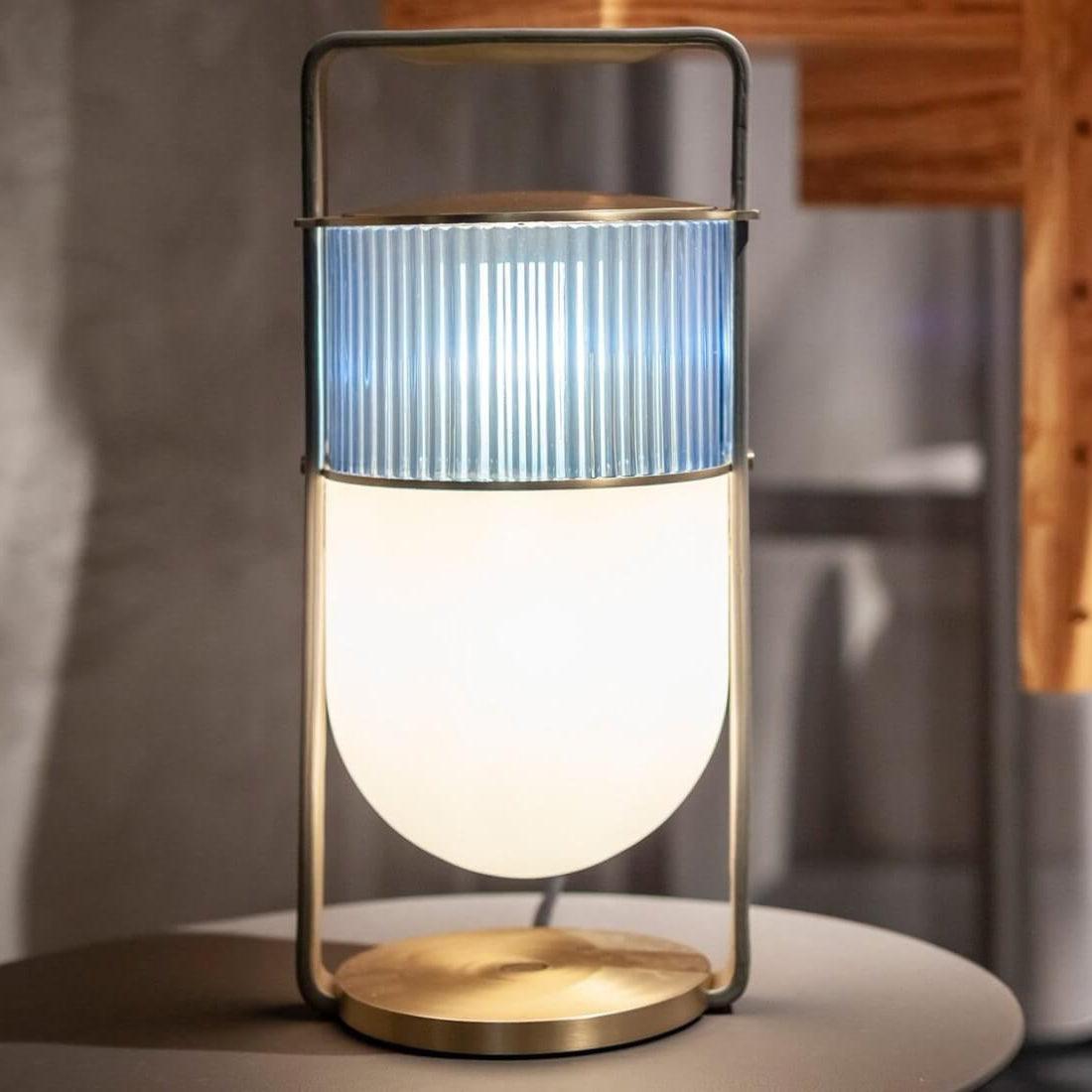 Side view of glass table lamp for scale and shape reference
