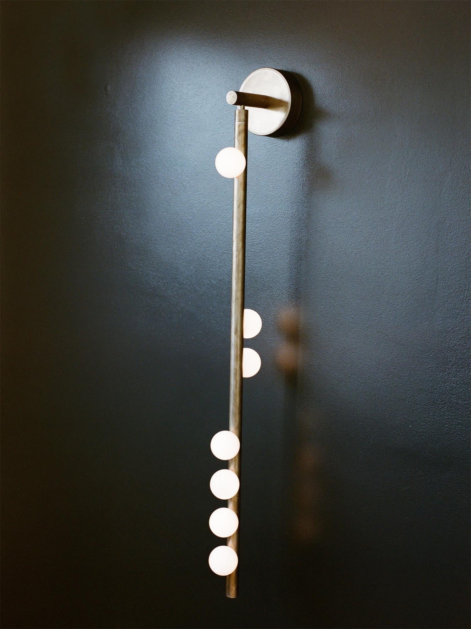 Close-up angle of Brass Halo Tube Wall Light Vanity Light showing form and material detail