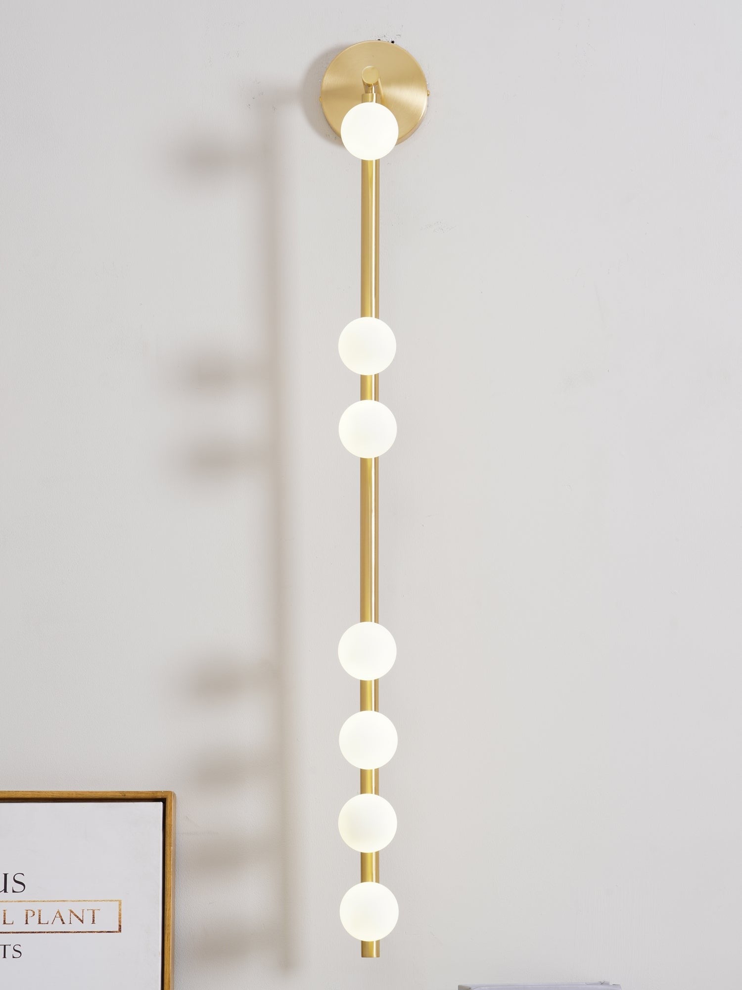Close-up angle of Brass Halo Tube Wall Light Vanity Light showing form and material detail