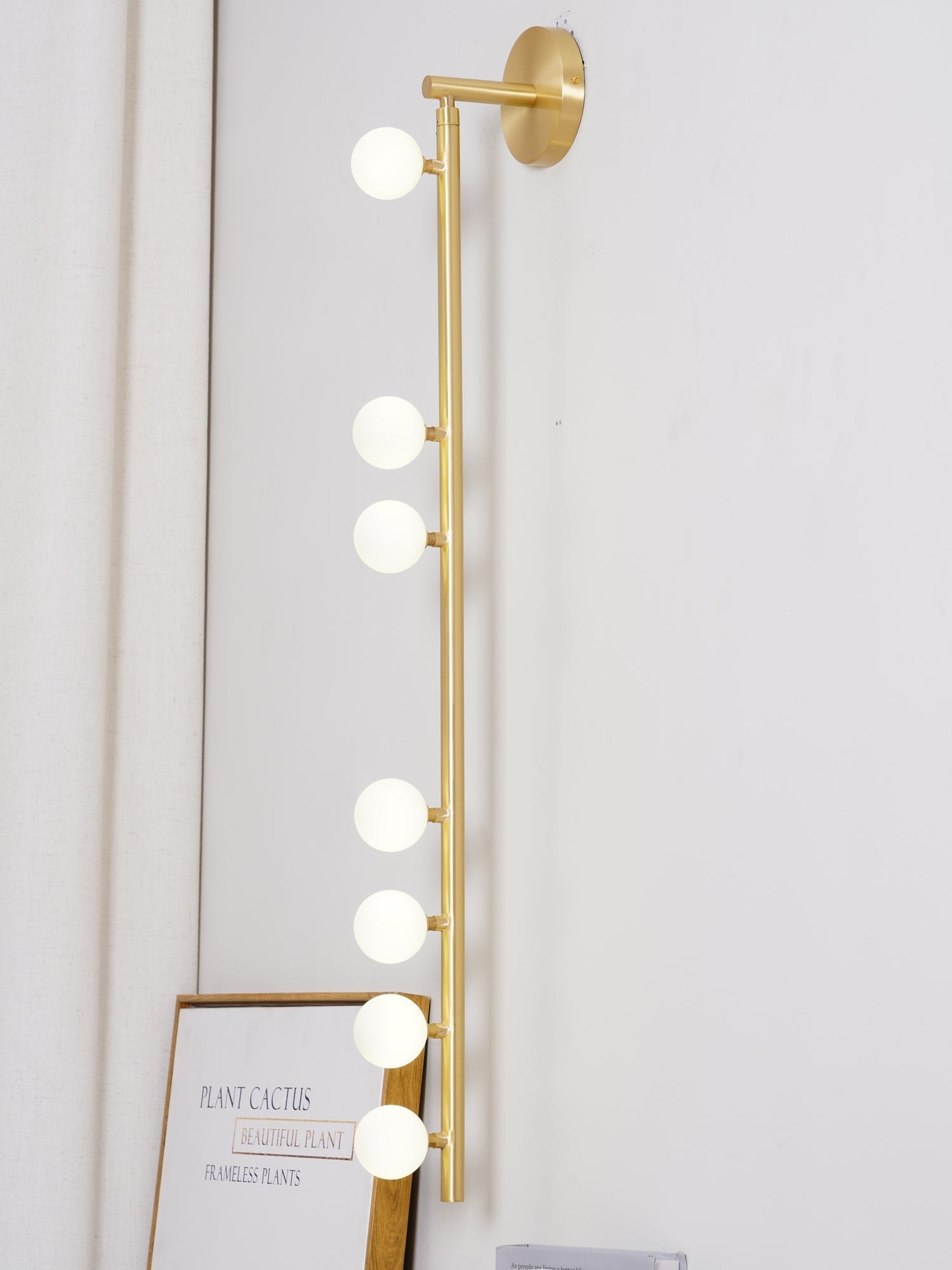 Side view of glass vanity light for scale and shape reference