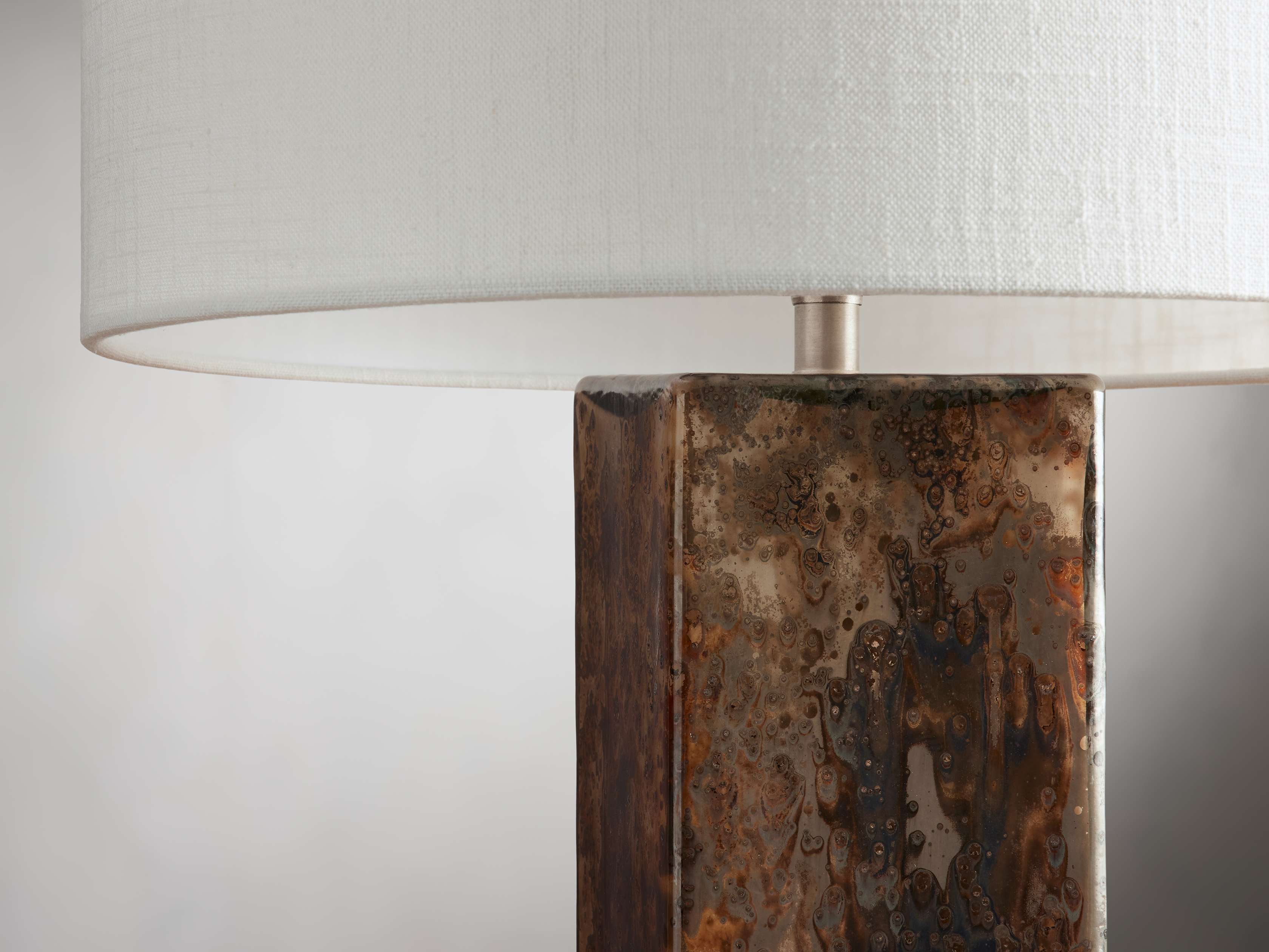 Side view of glass table lamp for scale and shape reference