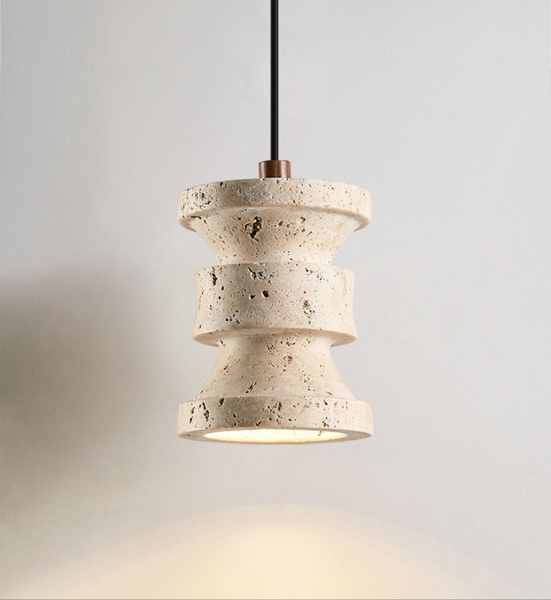 Close-up angle of Ardelle Travertine Pendant Lamp showing form and material detail