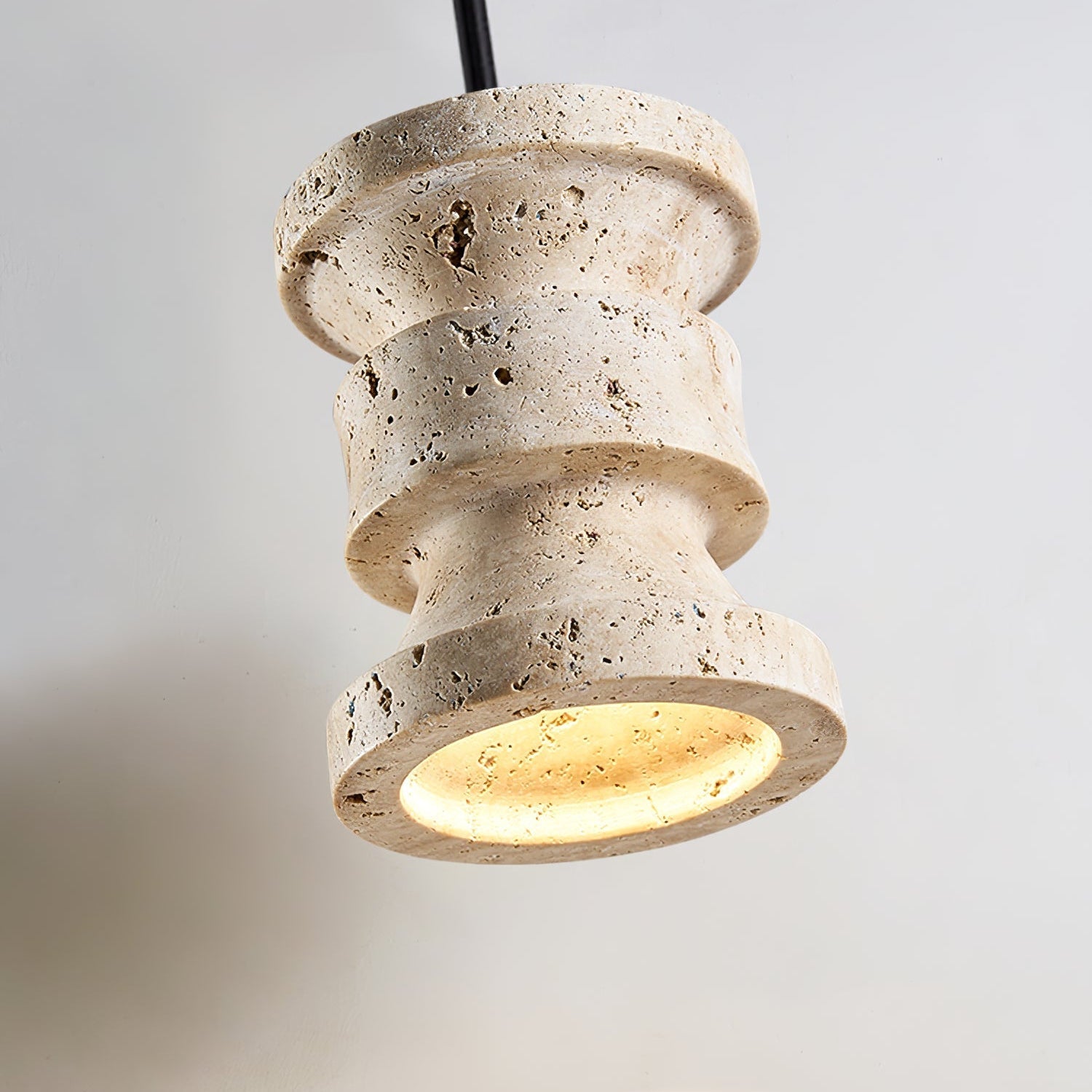 Close-up angle of Ardelle Travertine Pendant Lamp showing form and material detail