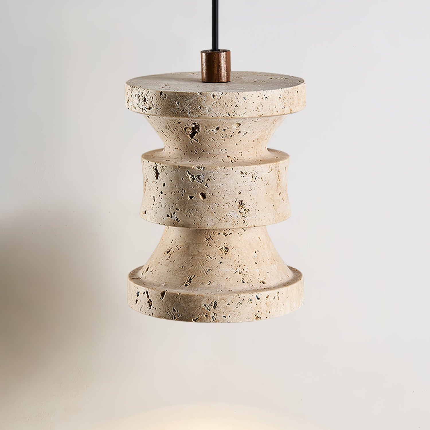 Side view of travertine pendant light for scale and shape reference