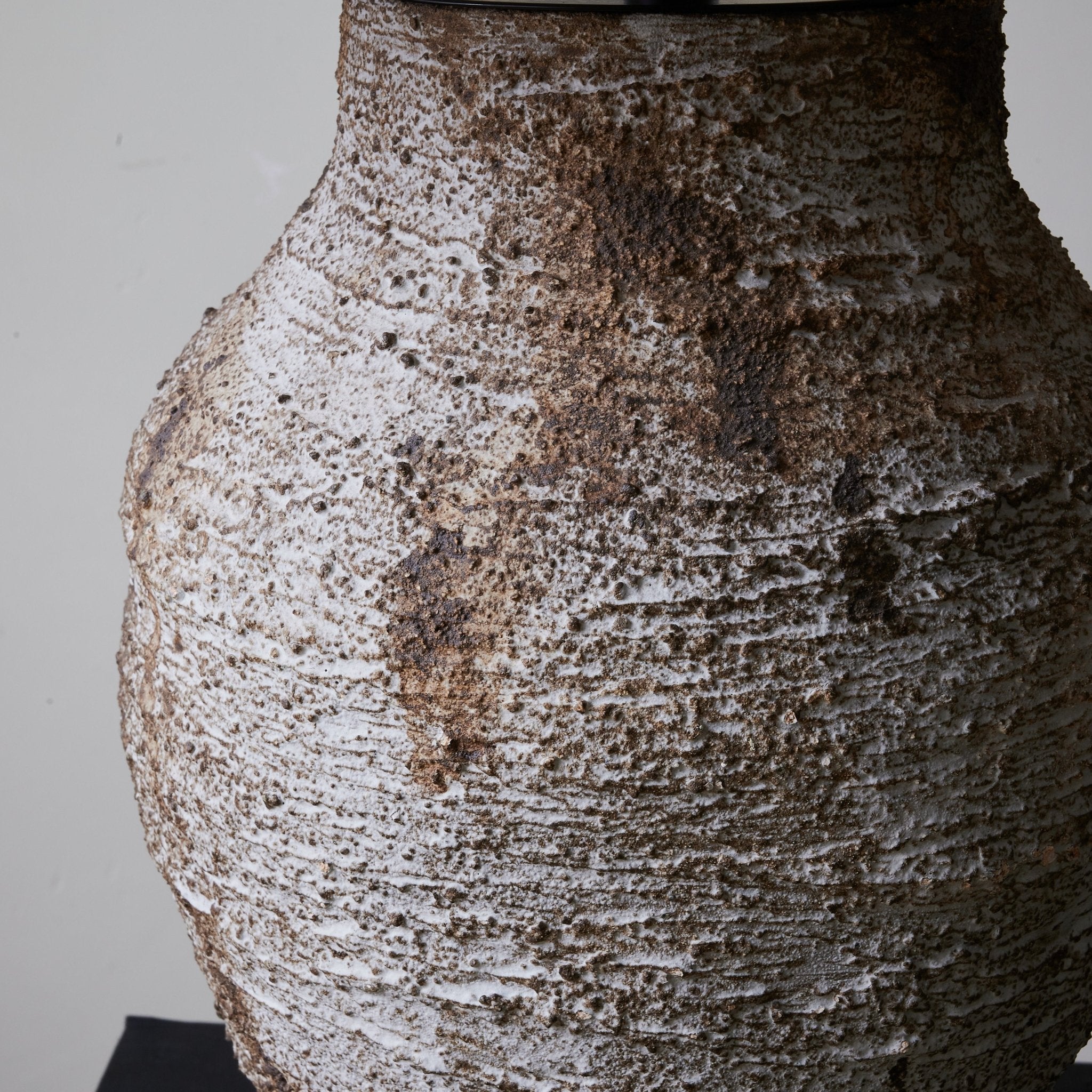 Side view of ceramic table lamp for scale and shape reference