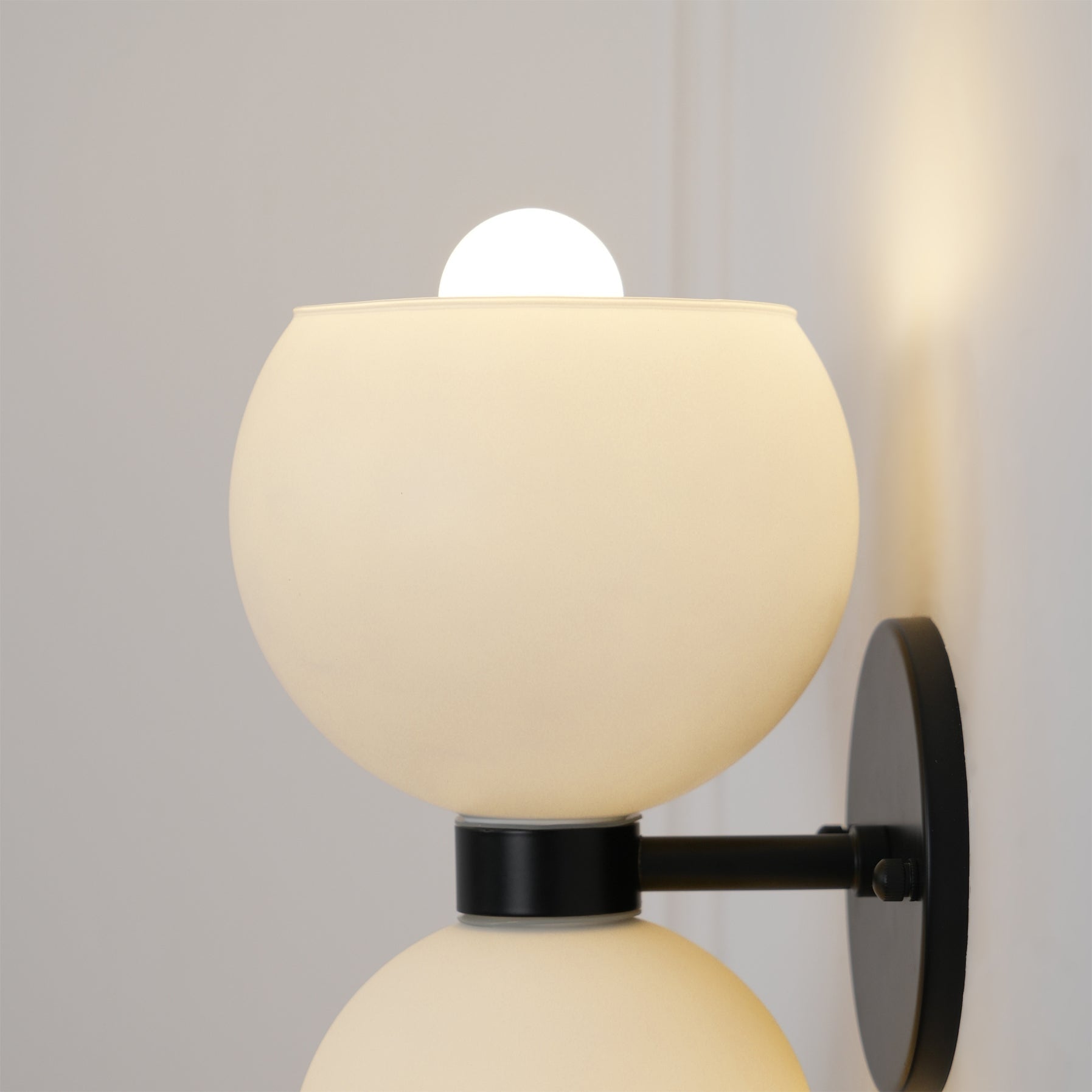 Close-up angle of Betty Wall Lamp showing form and material detail