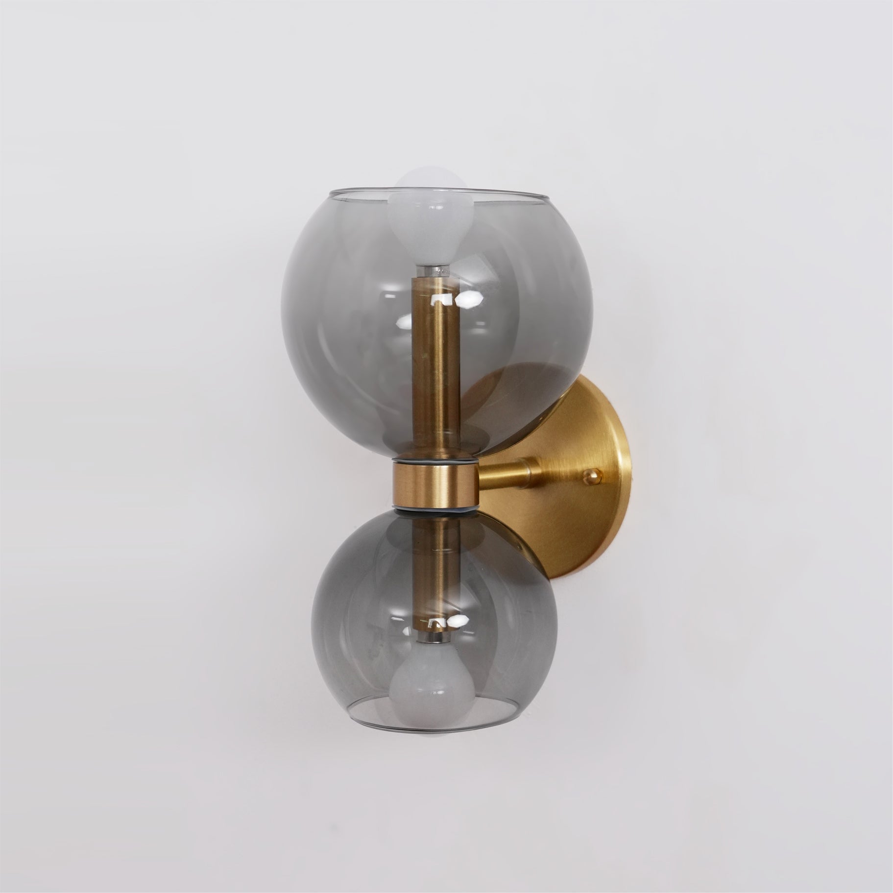 Side view of glass lighting fixture for scale and shape reference