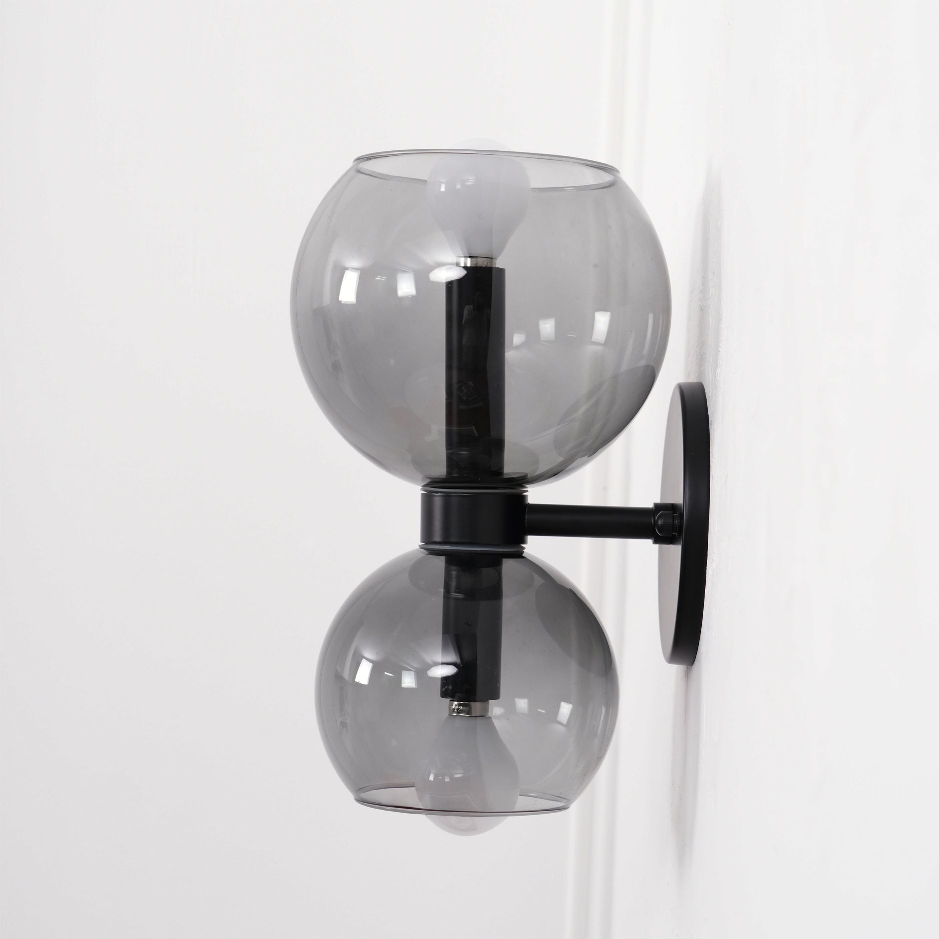 Side view of glass lighting fixture for scale and shape reference