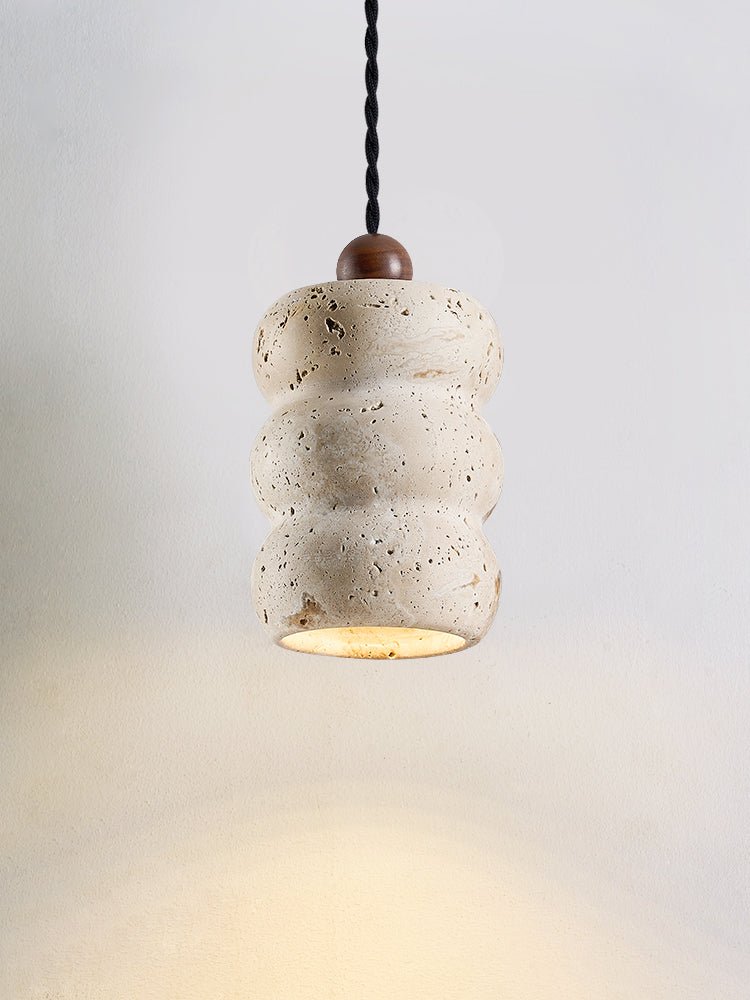 Close-up angle of Dune Pebble Travertine Pendant Light showing form and material detail