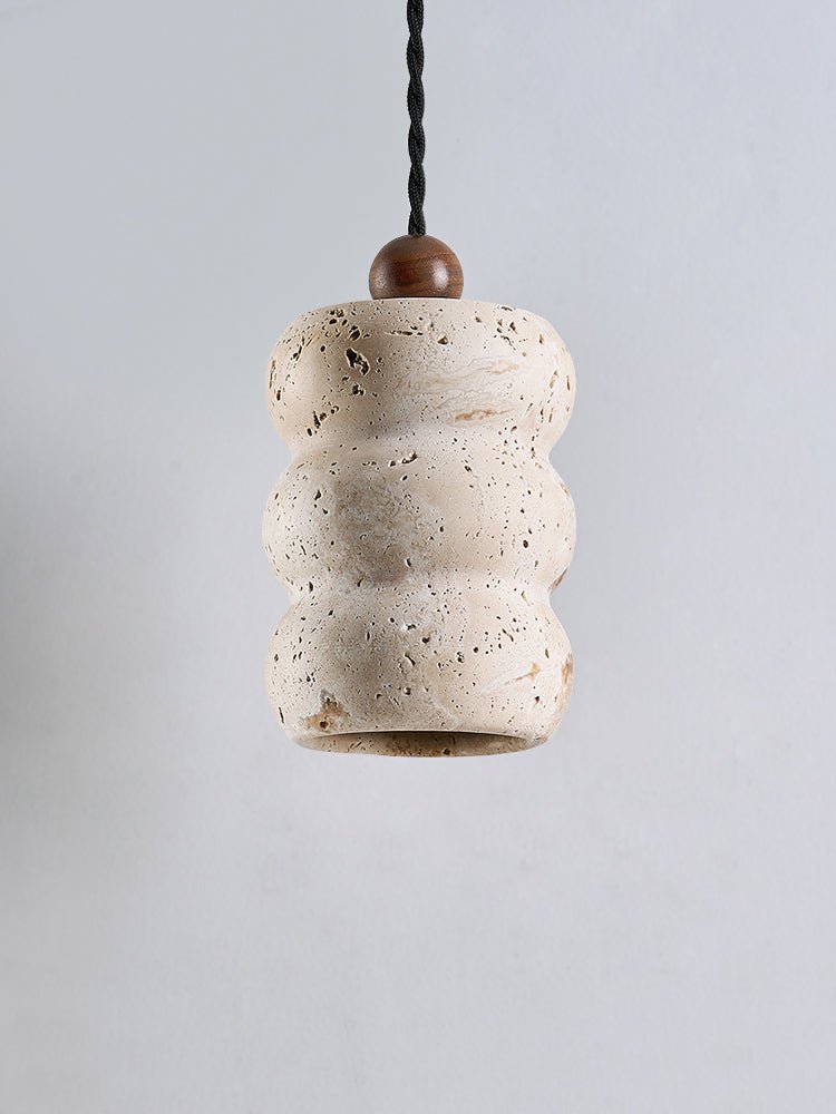 Close-up angle of Dune Pebble Travertine Pendant Light showing form and material detail