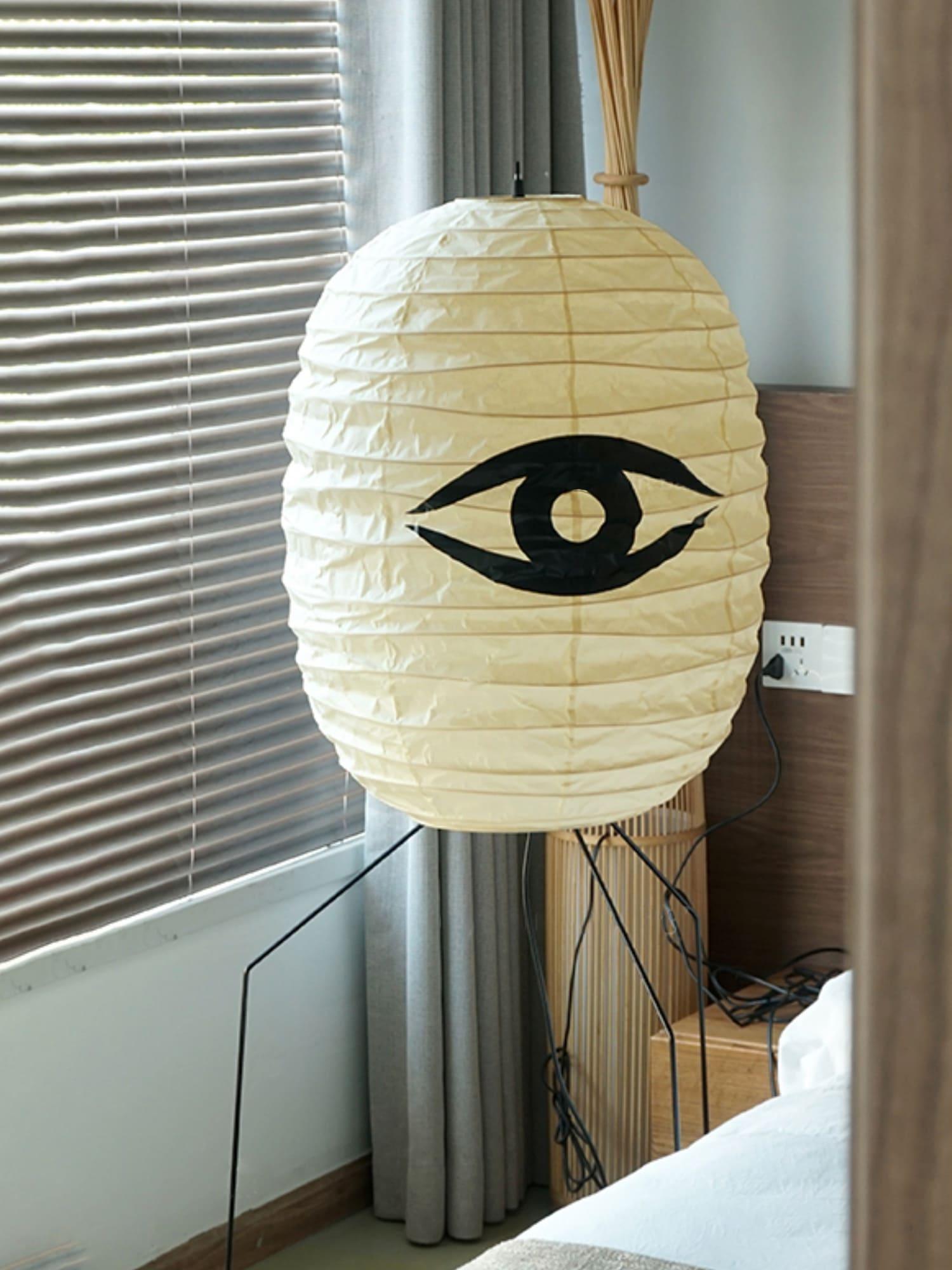 Side view of metal floor lamp for scale and shape reference