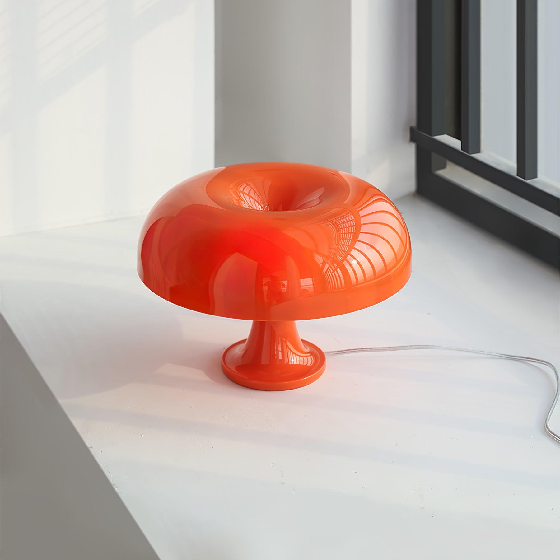 Side view of metal table lamp for scale and shape reference