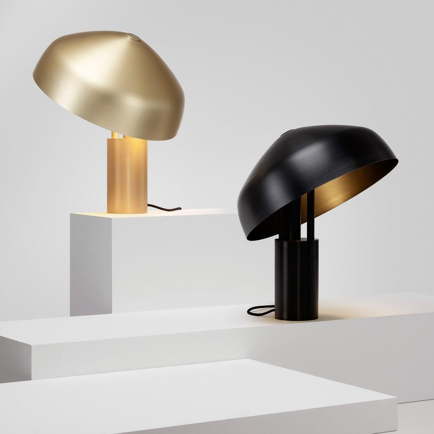 Side view of metal table lamp for scale and shape reference