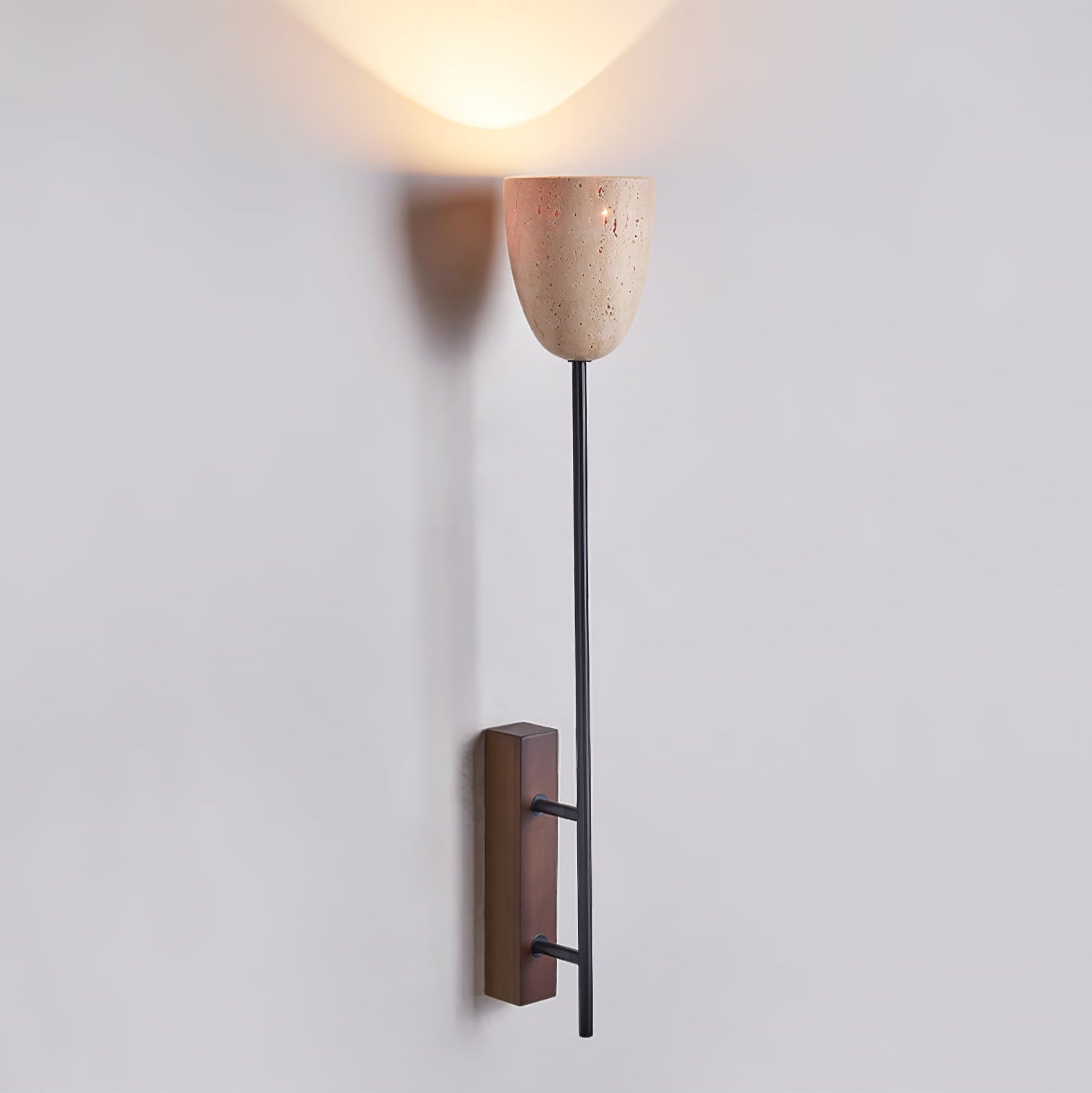 Side view of travertine lighting fixture for scale and shape reference