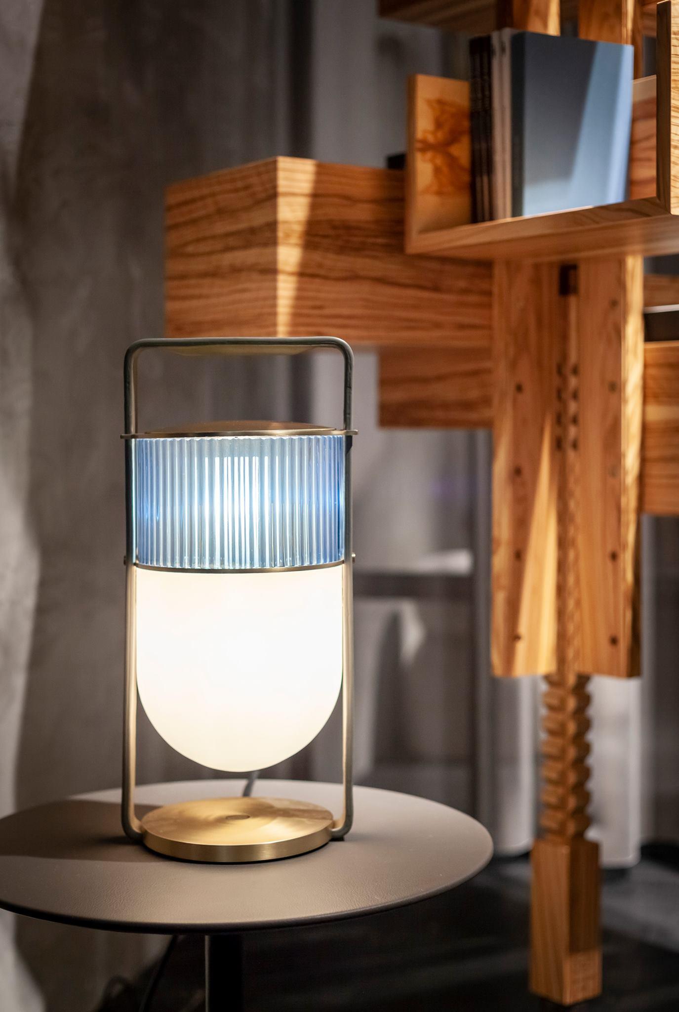 Side view of glass table lamp for scale and shape reference