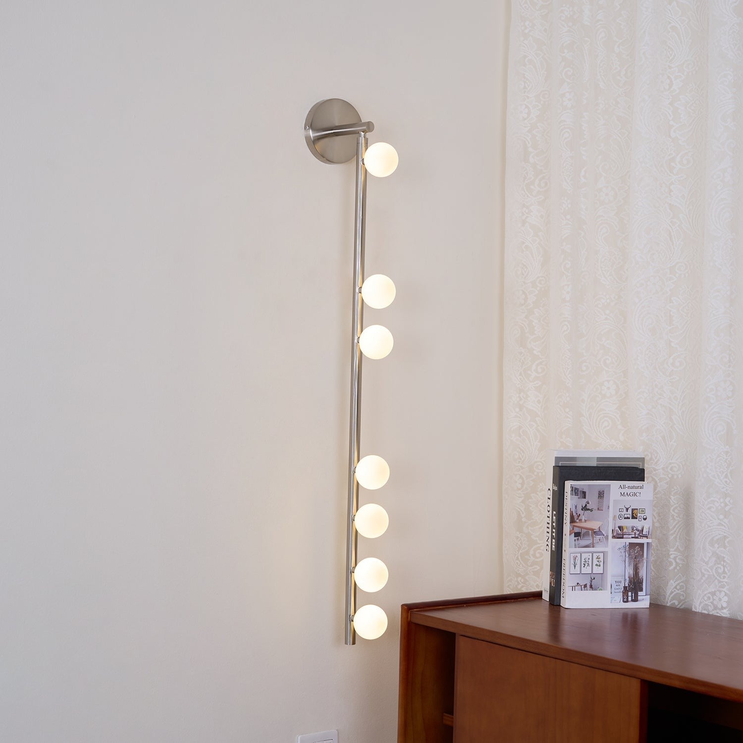 Side view of glass vanity light for scale and shape reference