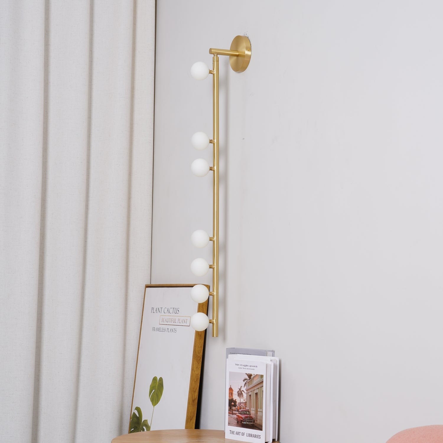 Side view of glass vanity light for scale and shape reference