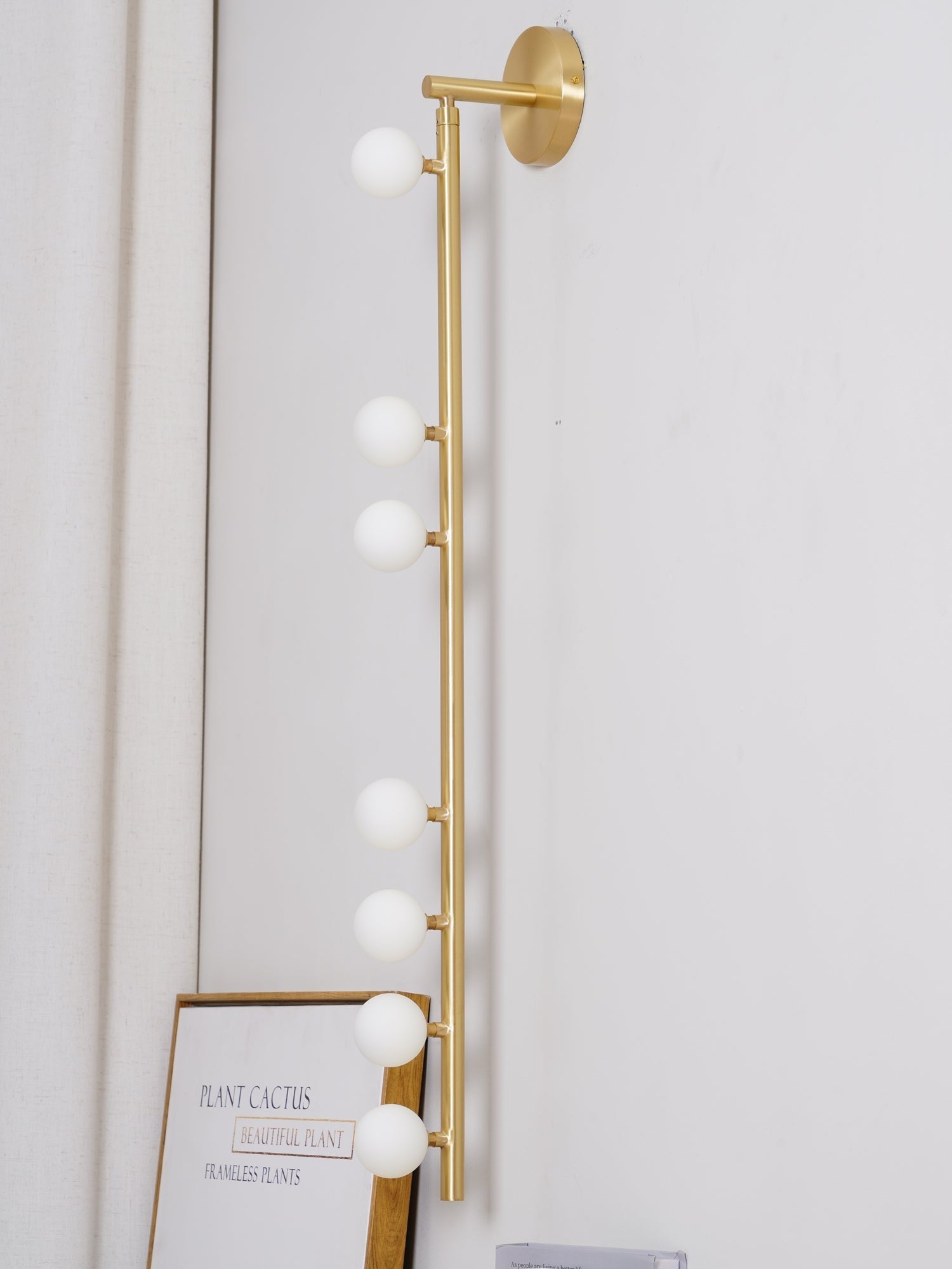 Close-up angle of Brass Halo Tube Wall Light Vanity Light showing form and material detail